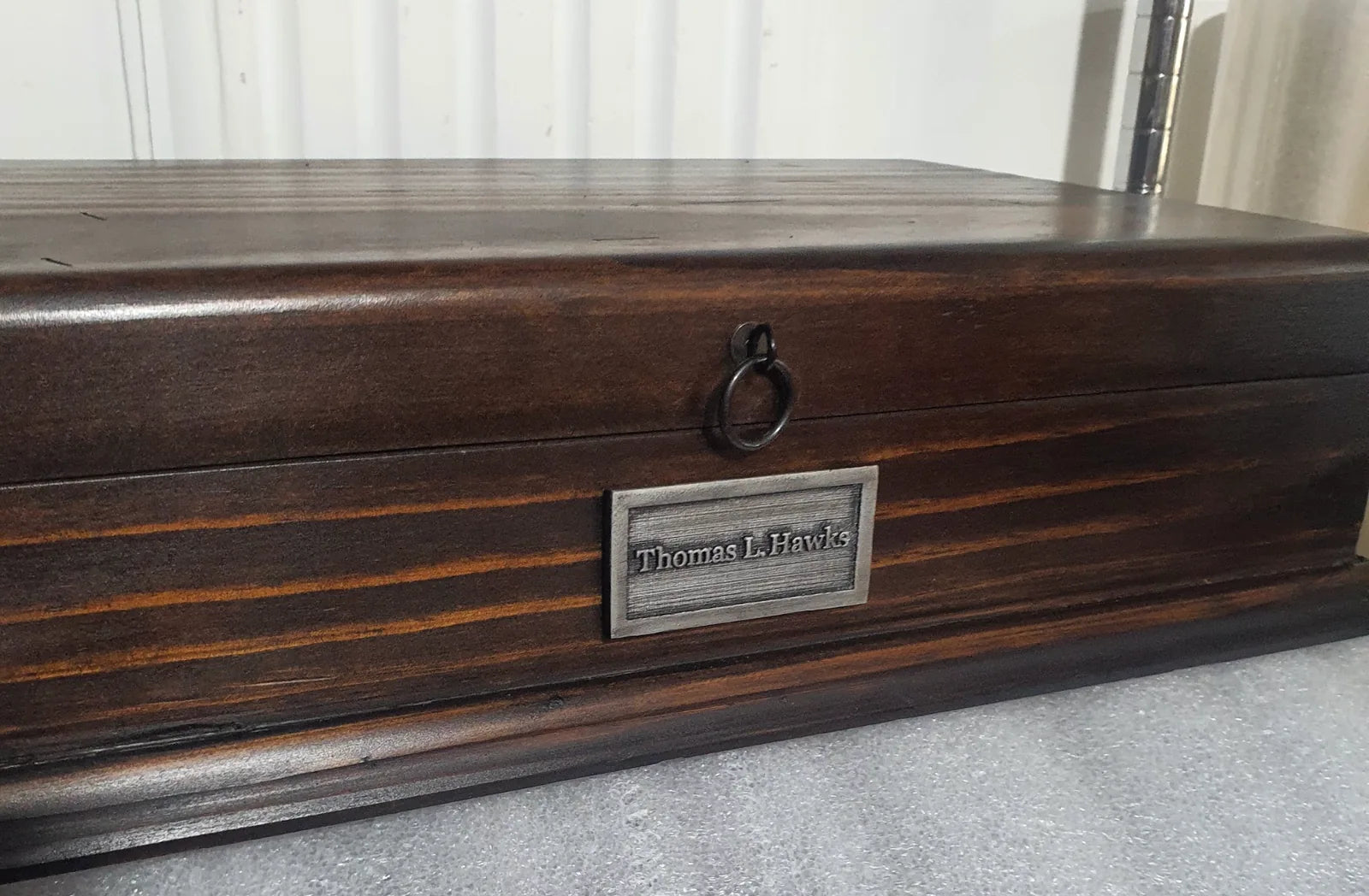 Customer photograph of a long handcrafted Deferichs box personalized with the name Thomas L. Hawks.